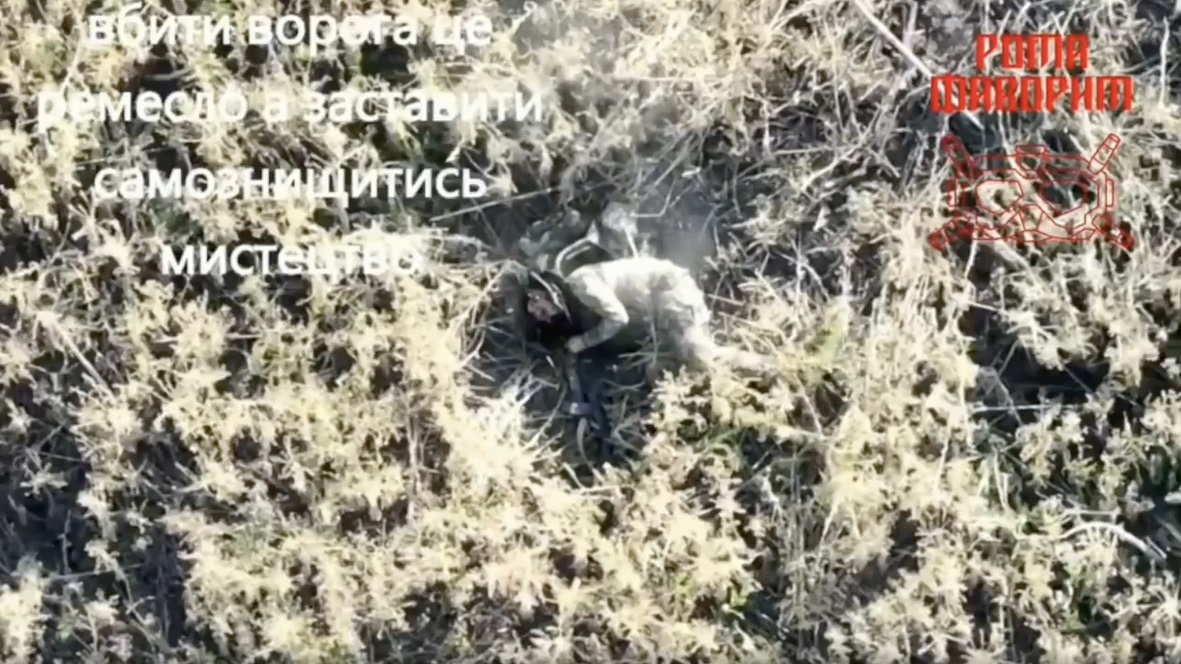 Russian walking through areas of shrubbery is struck by drone dropped grenade. Quickly decides to shoot himself