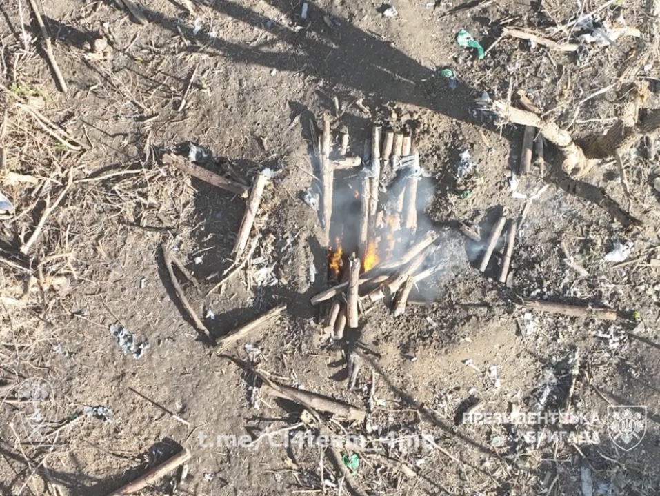 Russian in fortified pit is targeted by multiple drone drops, eventually blows up his own grenade