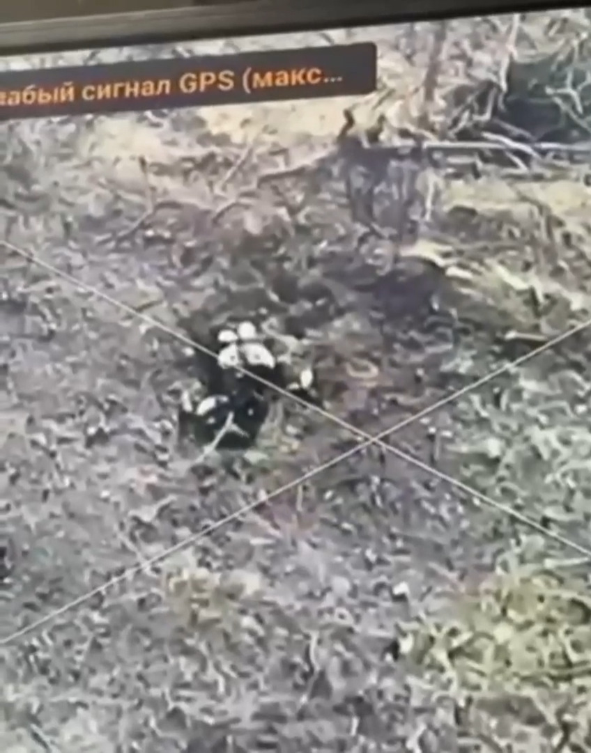 Wounded Russian in foxhole shoots at drone, then shoots himself