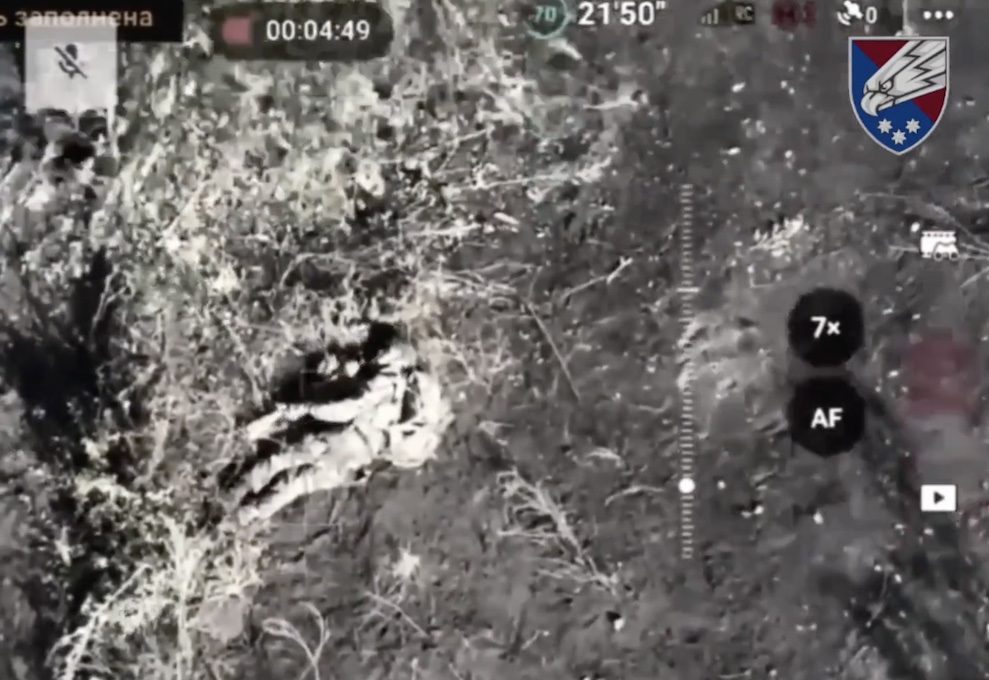 Russian soldier shoots himself in the head while lying on the ground with his backpack on