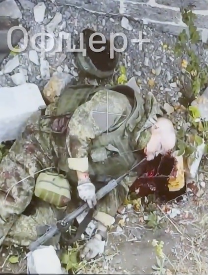Aftermath of Russian soldier having just killed himself, still breathing