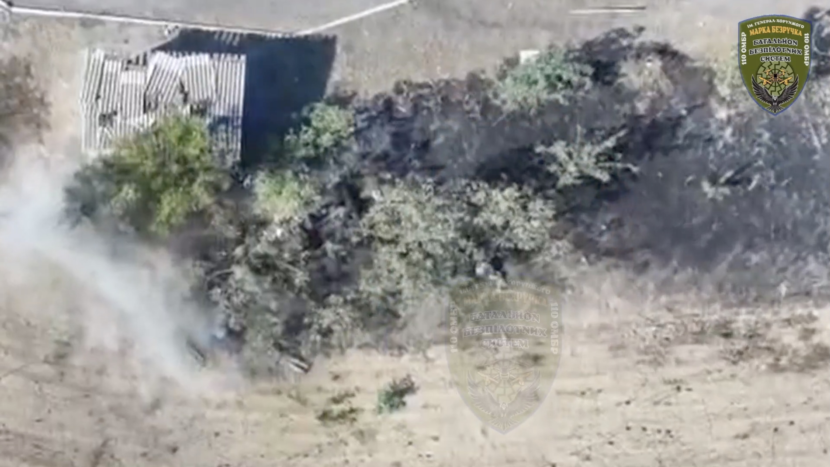 Russian soldier appears to detonate his grenade near bus stop his assault group was taking shelter behind