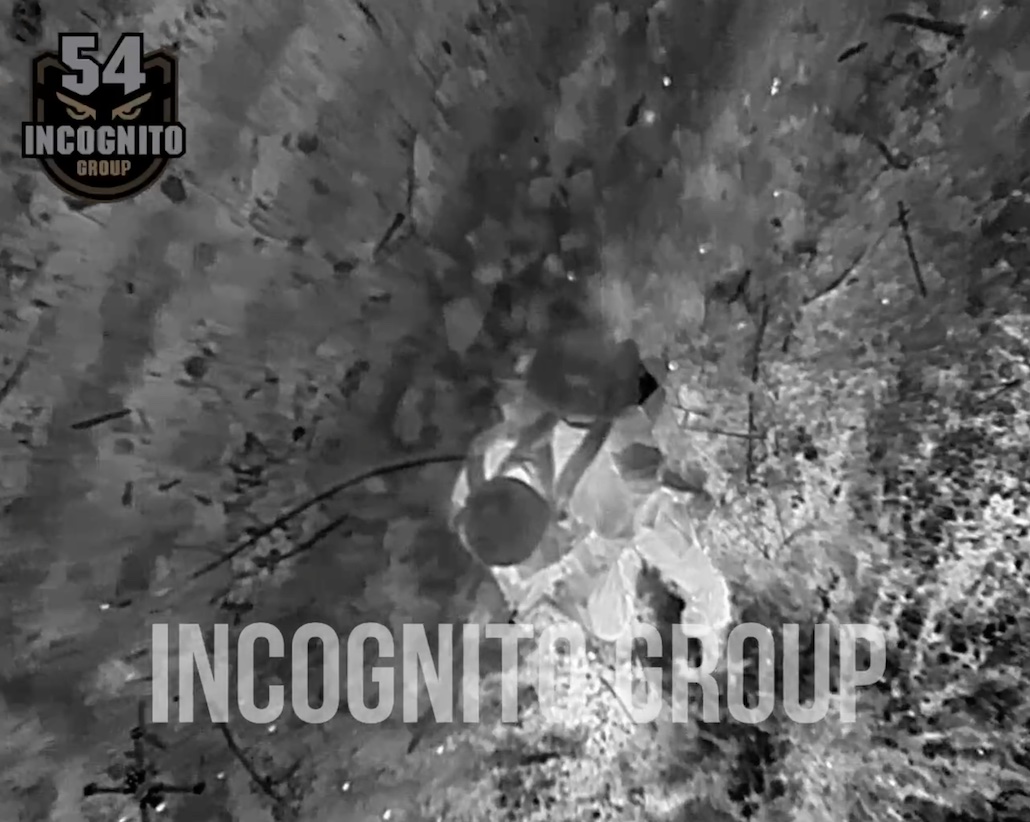 Drone drops grenade near Russian soldier while he walks casually. He immediately proceeds to detonating his own