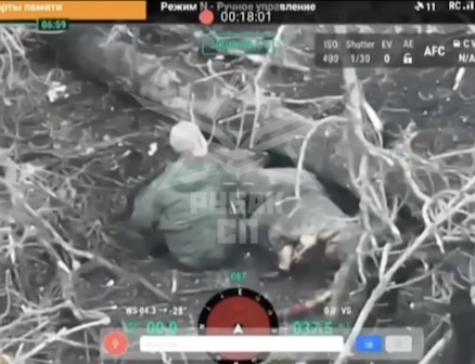 Russian soldier sitting next to his dead comrade under fallen tree, takes his helmet off and shoots himself