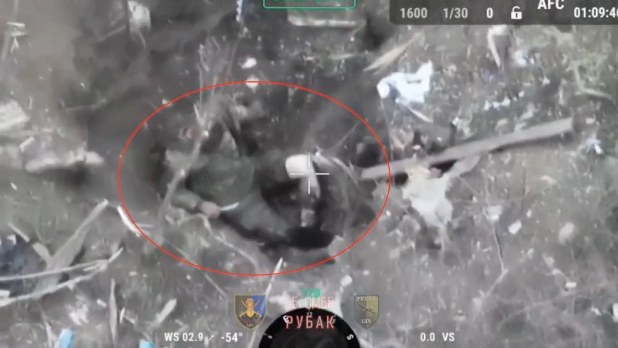 Russian soldier in a pit with wounded leg and no armour sticks knife in his neck