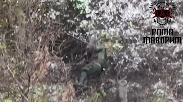 Russian is lying on the ground, takes grenade and detonates it to his chest