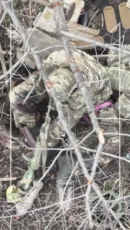 Russian soldier is seen with his AK on the ground pointed at his head. Moment before video cuts there is a shot