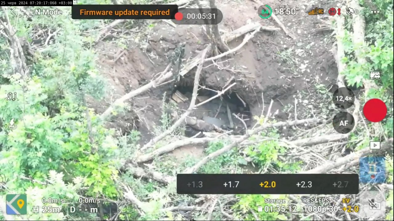 Russian soldier crawls through a trench, finds a rifle, test fires it to make sure it works, pauses, then shoots himself in the head