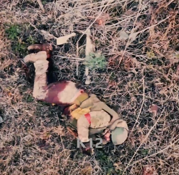 Russian is hit by close drone drop while walking around. With his leg visibly injured and bleeding, he puts grenade under himself and detonates