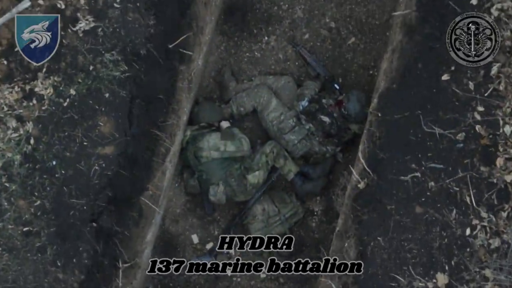 Presumably wounded Russian lying next to his dead comrade in a trench decides to pull grenade and detonate himself