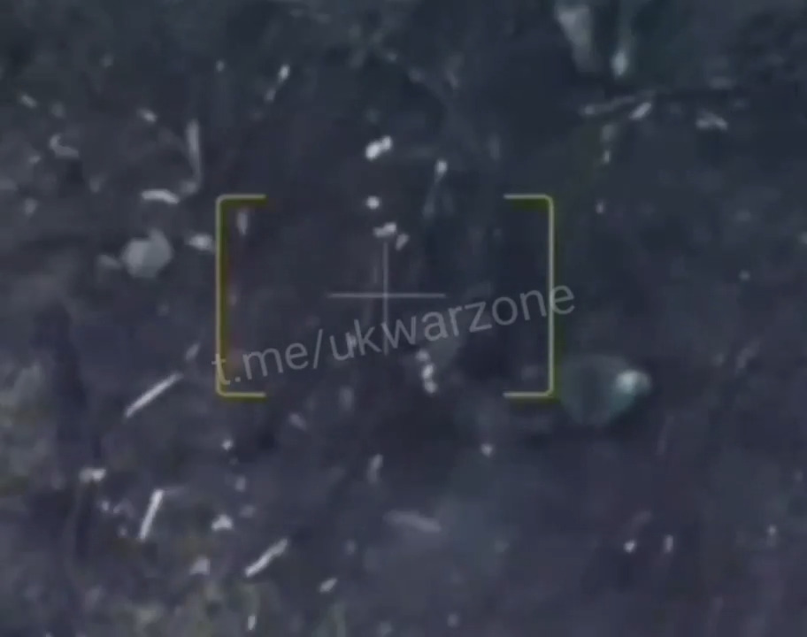 Russian soldier in shell hole, possibly wounded, shoots himself