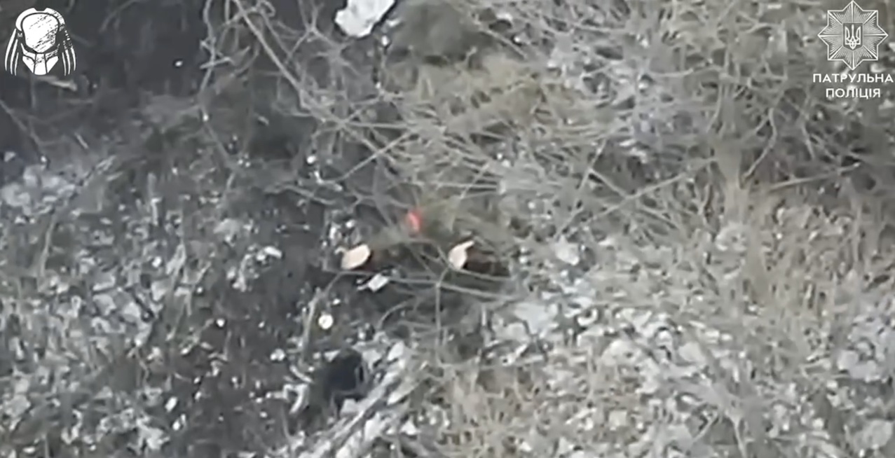 Russian is under drone dropped attack, eventually is seen without helmet grabbing his AK and shooting himself