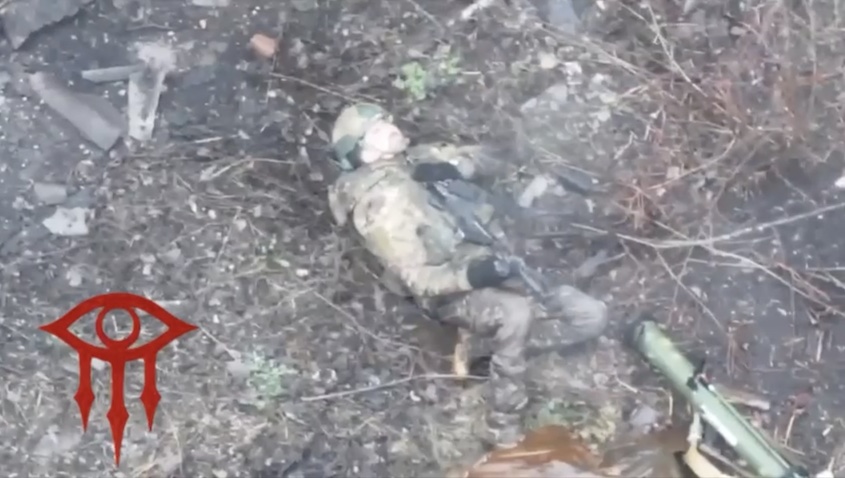 Russian is seen shooting himself while lying on the ground face up