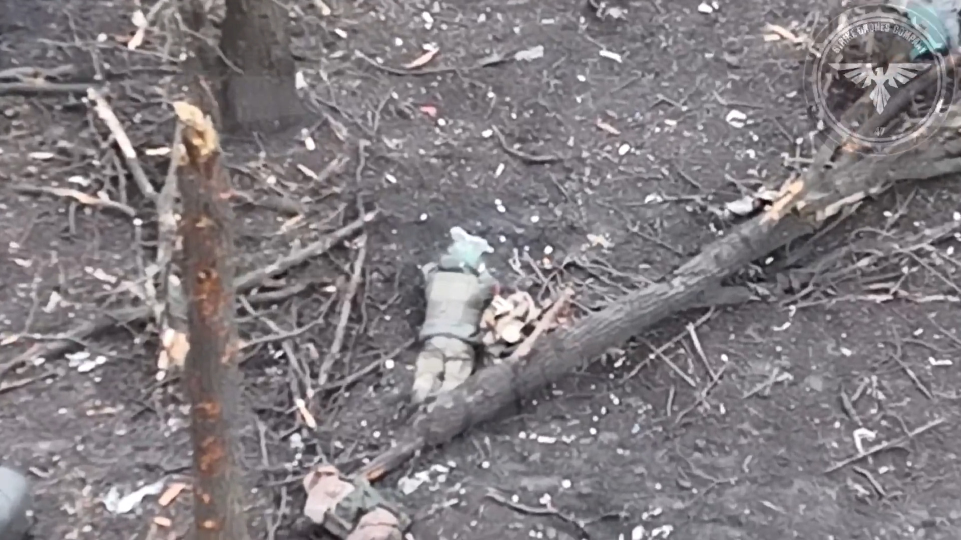Russian soldier laying amongst casualties appears to set off own grenade, death is not immediate