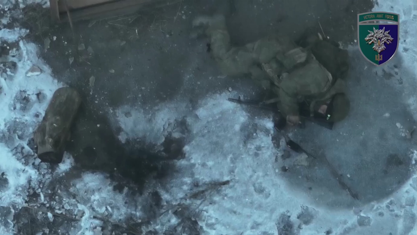 Russian is hit by multiple drone drops near barn, is seen lying on the ground and detonating his own grenade to his face