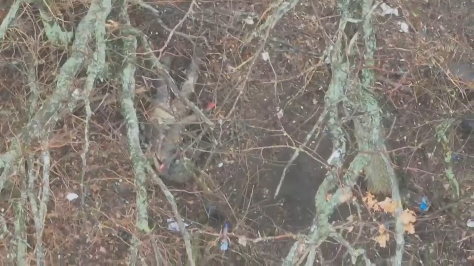 Drone targets Russian soldier with dropped grenades seen via thermal view, then camera switches to daylight only to capture him shooting himself