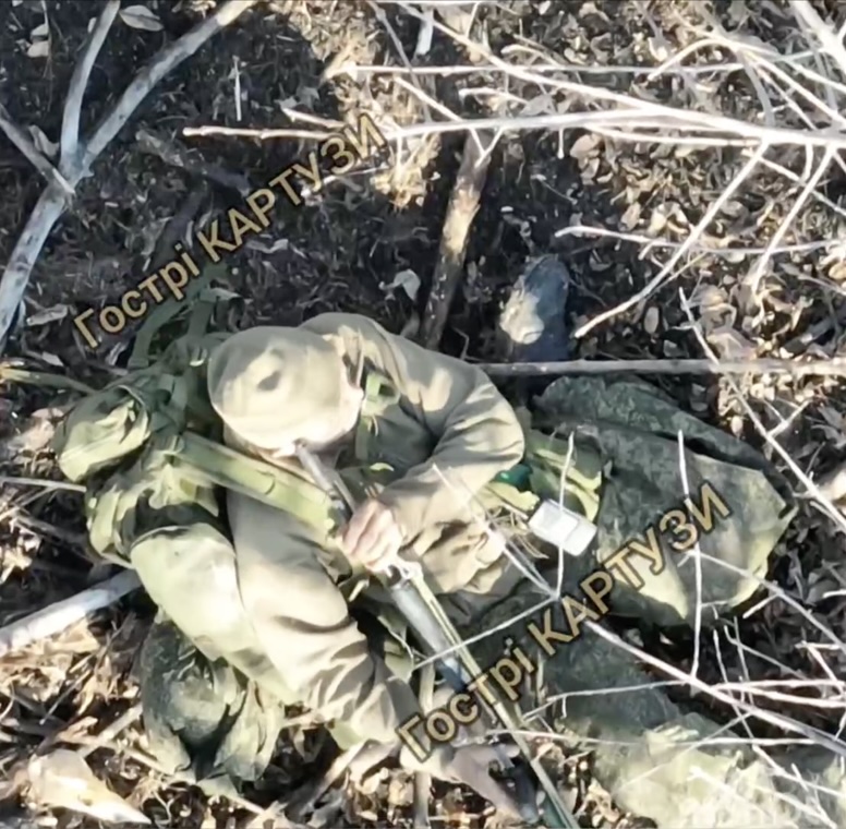 Russian receives close drone drop while standing among trees, immediately proceeds with shooting himself in temple on full auto to extremely graphic aftermath