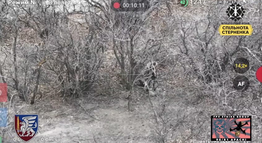 Russian with no helmet in the bushes receives close FPV hit, grabs his AK and tries to shoot himself in the temple but it won't work. He plays with it another minute or two, tries again, now successfully