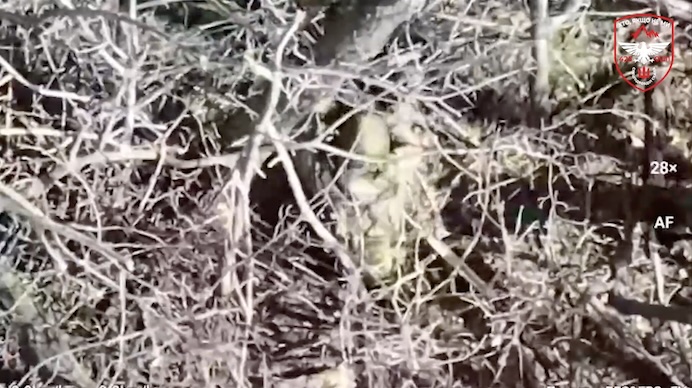 Russian is seen shooting himself in the face, the view is from behind