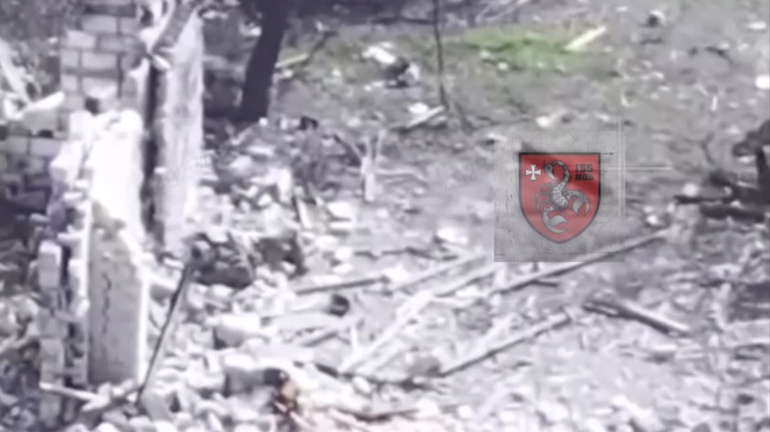 Russian sits under ruin, throws away his helmet and grabs his AK. He first tries to stand up but falls, turns to his back and proceeds with shooting himself in the head