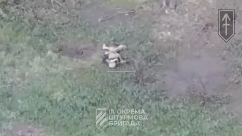 Russian soldier is hit by FPV while walking along the trail. His comrade is running by without stopping to check on him, narrowly avoids another FPV attack but later is seen receiving close drone drop near treeline, falling onto the ground and eventually shooting himself
