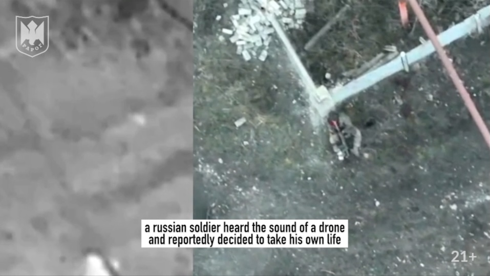 Russian is seen sitting near some ruin and shooting himself