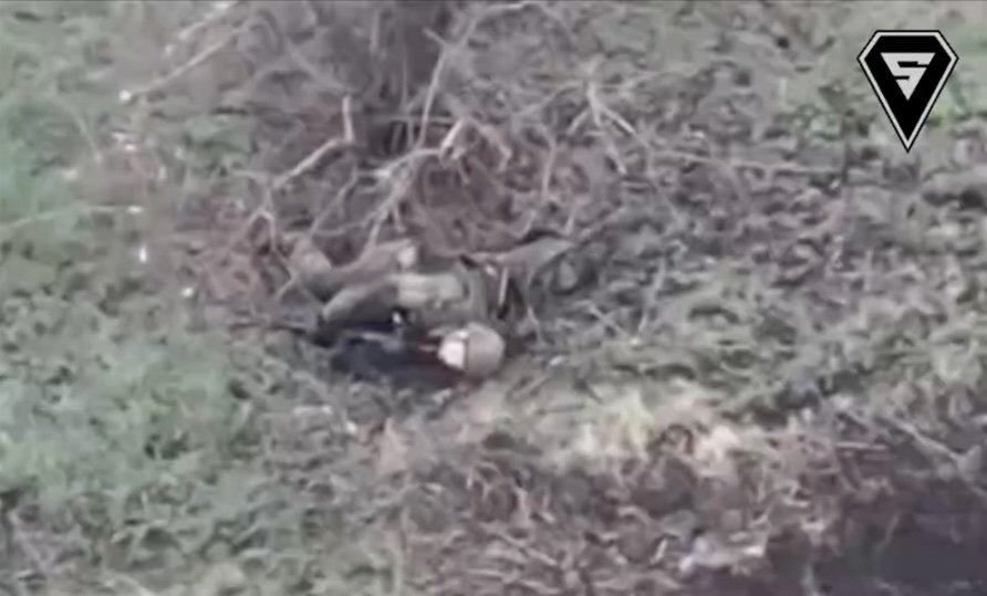 Equipped Russian soldier receives direct FPV hit while lying under lonely tree, immediately grabs his AK and shoots himself