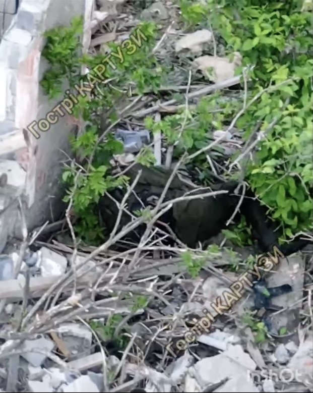 Russian is lying under a tree beside some ruin, apparently injured. Seen from behind, he pulls the pin on his grenade, brings it to his chest and detonates. It explodes rather violently
