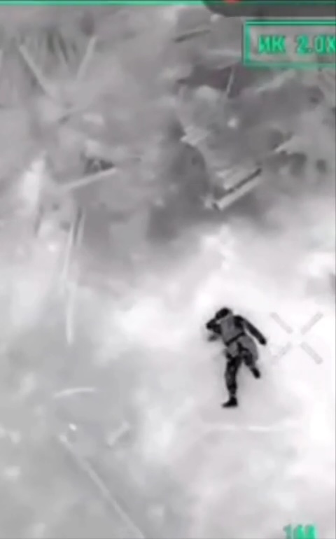 Thermal footage of presumably wounded Russian soldier lying on his back, pulling the pin on his grenade and detonating it in a violent explosion that blows his head away