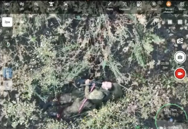 Russian is lying on his back, his left leg is visibly broken. He shoots at the drone flying by to no avail, then points his AK under his chin and shoots himself. FPV hits few moments after