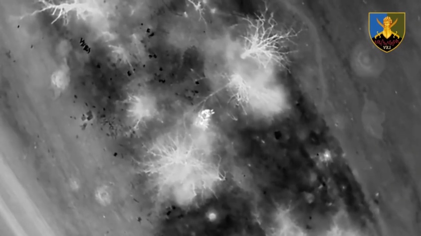 Thermal view of Russian soldier sitting among trees under drone drop attack, grabbing his AK and shooting himself