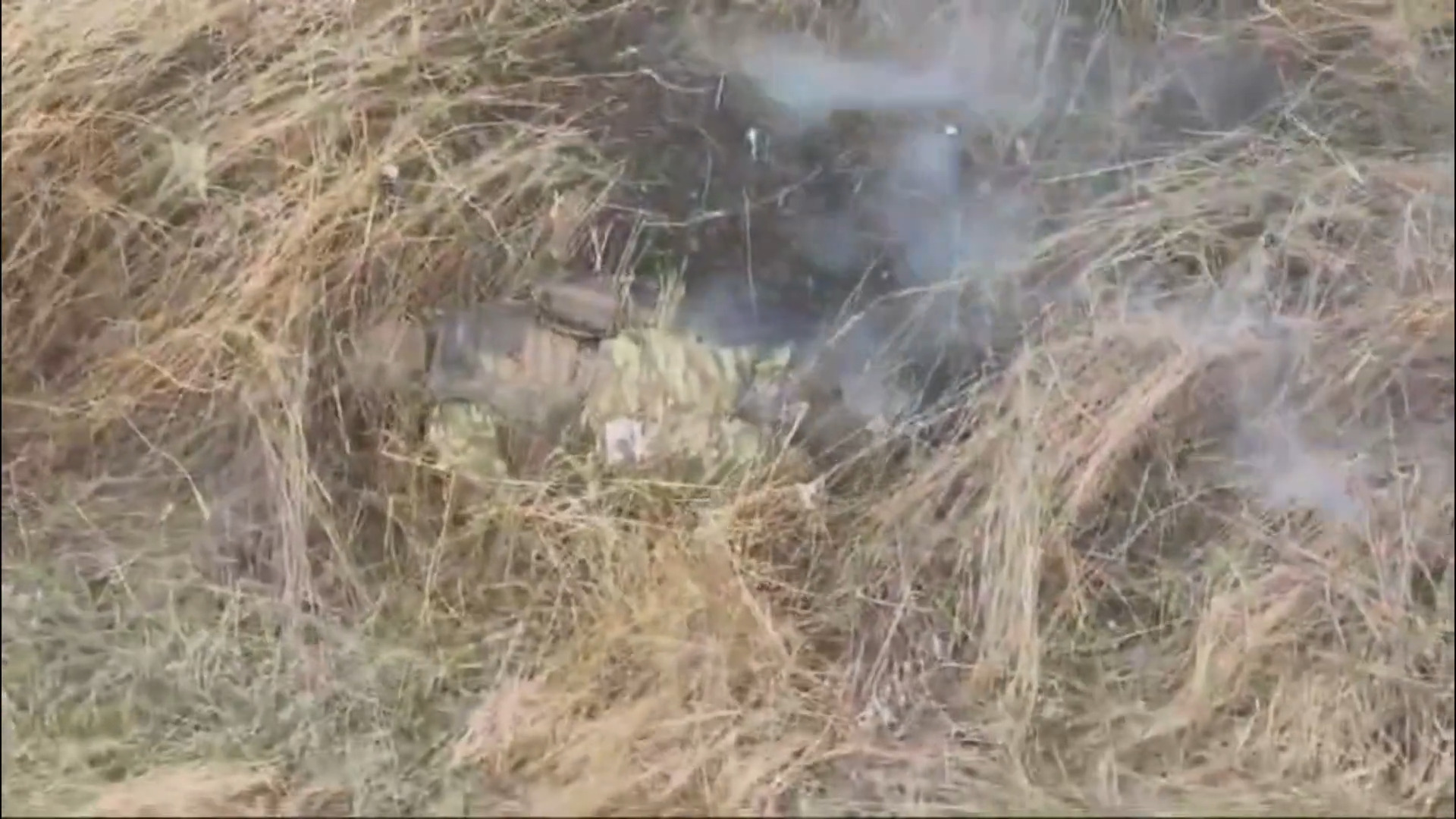 A Russian soldier receives a leg wound from a drone dropped grenade. Immediately kills himself by putting a grenade underneath his vest