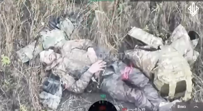 Same video, different scene. Fully equipped Russian lies on the ground besides his backpack and rifle, apparently injured. He receives another near direct FPV hit. Quick cut till his helmet is off, he wears glasses. In agony, he takes grenade and leaves it on his belly to detonate