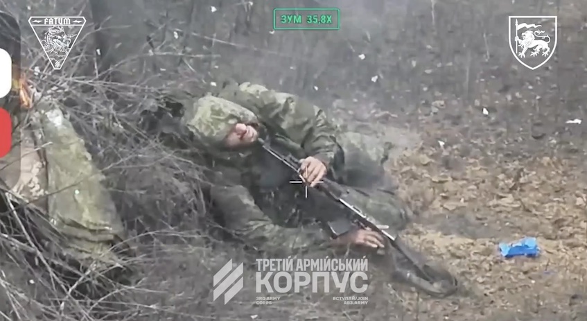 Russian receives FPV hit while crossing a ditch, later is seen on the bottom of it shooting himself with his hood on