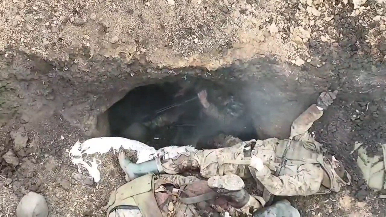 Russian soldier in a foxhole is wounded by grenade, then shoots himself