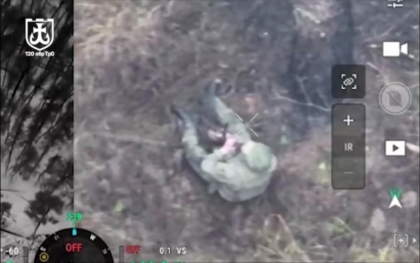 Russian in the woods receives hit of unknown origin, falls on the ground, immediately grabs his AK and shoots himself