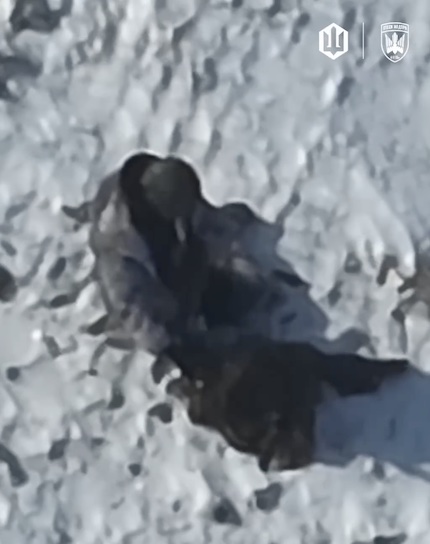 Russian walks across open field, is attacked by FPV that misses by a few meters. For a moment it looks like he's about to shoot himself but he stands up and walks away. Later is seen giving up, taking a sip of water from his backpack and finally shooting himself with his AK