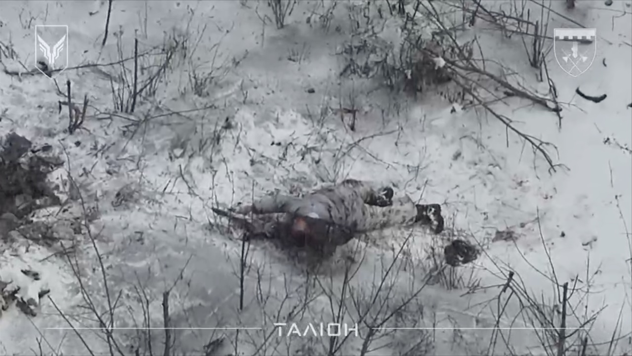 Russian soldier shoots himself while lying on the snow belly down, apparently injured