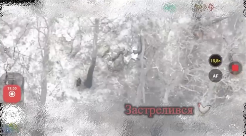 Quick cut featuring Russian soldier shooting himself while lying on the snow among trees, seen right from above