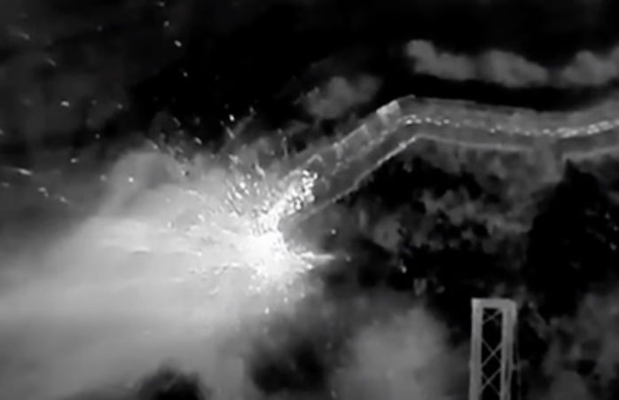 Group of Russians hides in the trench, is under drone drop attack that hits quite accurately. One of them appears to detonate his own grenade between the drops