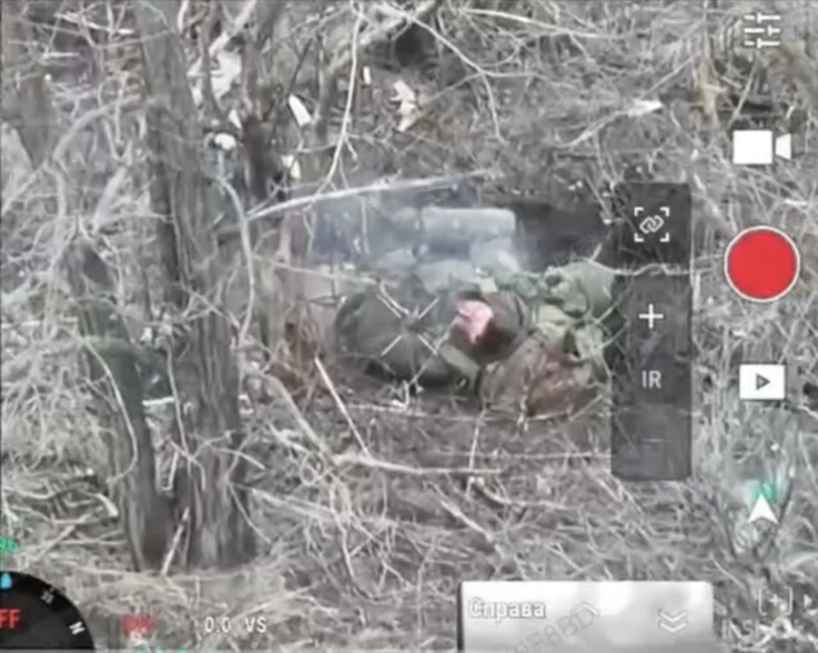 Russian lies on the ground in a tree line in an aftermath of some kind of attack, he's on fire. He grabs his AK, seems to make few test shots, and shoots himself as camera zooms out and back in