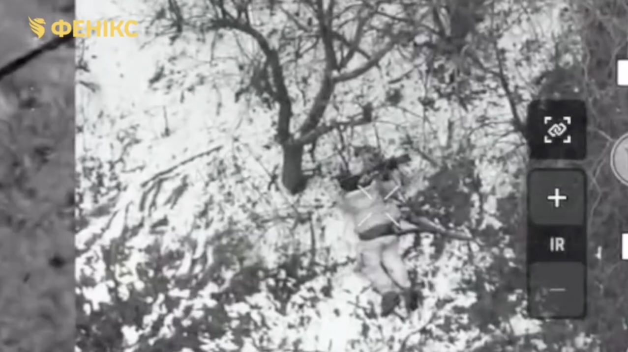 Quick cut featuring Russian soldier lying on the snow his belly down aimig his AK at his temple just a moment before something hits