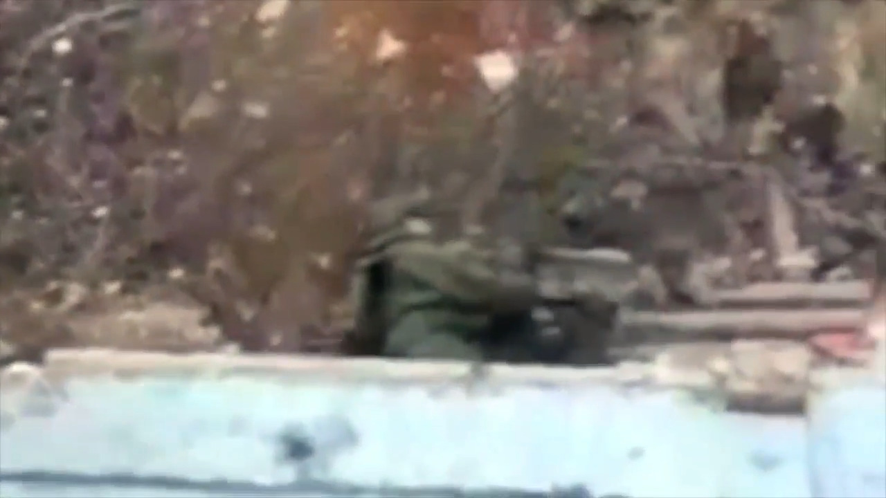 A Russian soldier shoots themselves as Ukrainian drone watches