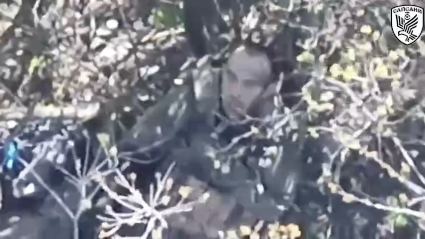 Middle aged Russian soldier with no helmet shoots himself with his rifle pointed under his chin