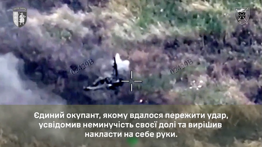 Fully equipped Russian soldier receives FPV near miss while crossing open field. Lying on the ground, and apparently injured, he promptly points AK at his chest and shoots