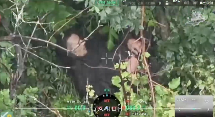 Russian with no gear whatsoever is hiding among trees while it's raining. He takes rgenade, pulls the pin and keeps holding it firmly over his belly. As camera zooms out, an explosion is seen