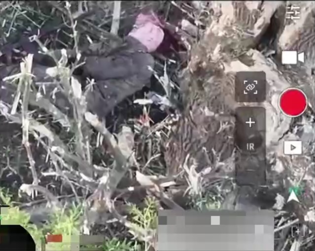 Russian soldier appears to shoot himself under the tree as FPV drone approaches. Although FPV footage barely reveals anything, the aftermath view shows fairly typical suicide scene with AK lying besides