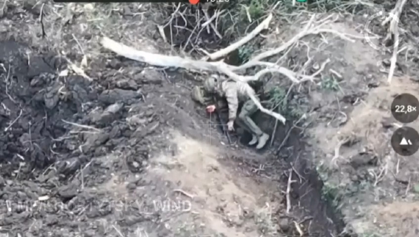 Russian soldier wounded by an explosion shoots himself. His hand sticks on trigger and empties magazine on full auto