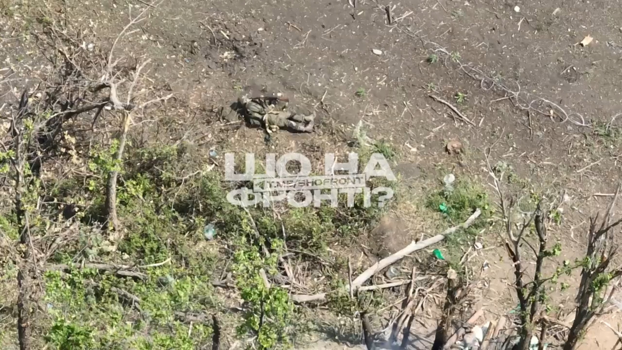 Russian soldier lying on the ground and apparently wounded, shoots himself in the head