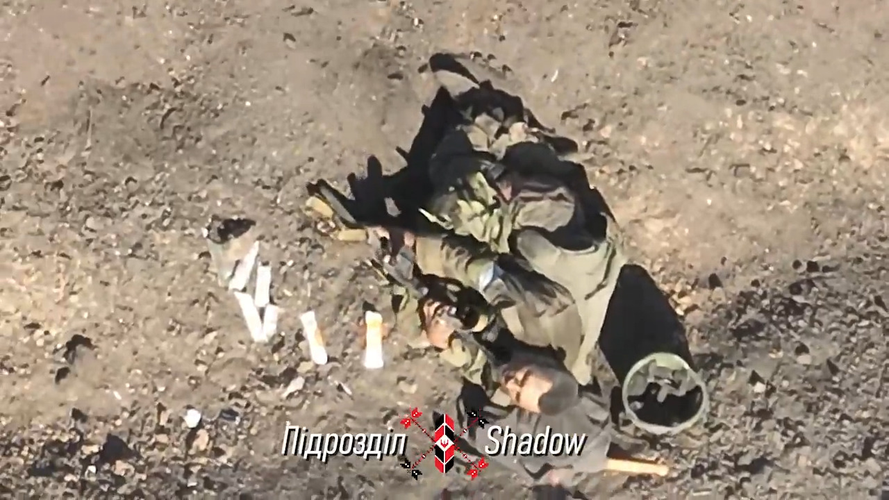 Russian soldier is targeted by multiple drone drops, decides to shoot himself but rifle fails, then uses grenade
